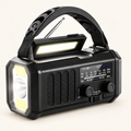 Black AM/FM radio with carry handle and raised reading light